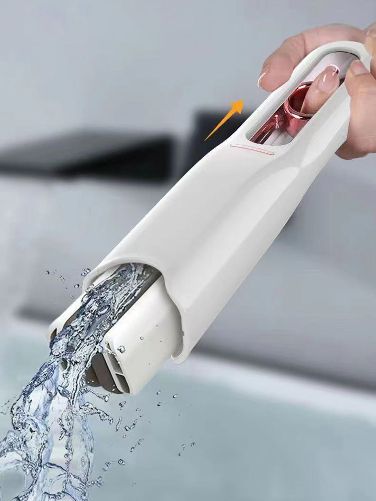Mini squeeze mop in use on glass